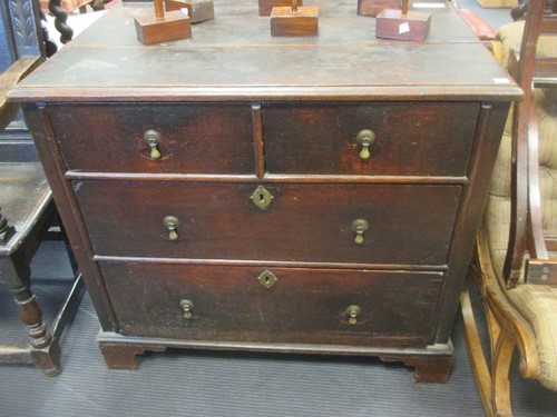 Lot 513 - An early 18th century oak chest of 2 short and...