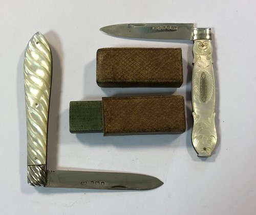 Lot 335 - Two Victorian silver and mother of pearl folding fruit knives, one with its original case