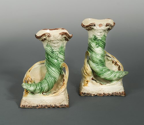 Lot 5 - A rare pair of 18th century Staffordshire cornucopia vases