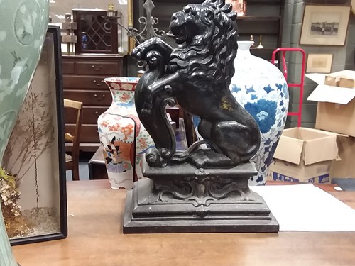 Lot 110 - A 19th century cast iron door stop with...