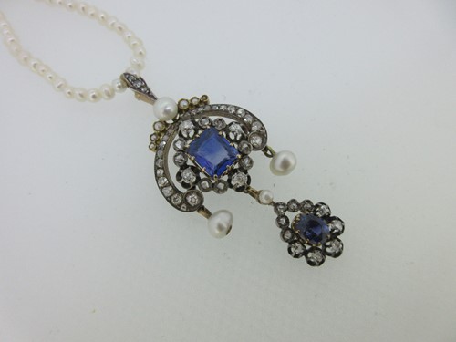 Lot 232 - A late 19th century sapphire, diamond and pearl pendant on a  string of seed pearls