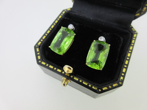 Lot 216 - A pair of peridot and diamond earpendants