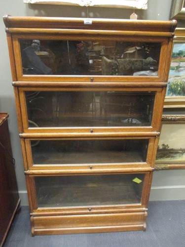 Lot 478 - A pair of globe wernicke and co. oak four...