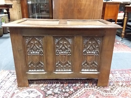 Lot 449 - A 20th century oak coffer with carved and...