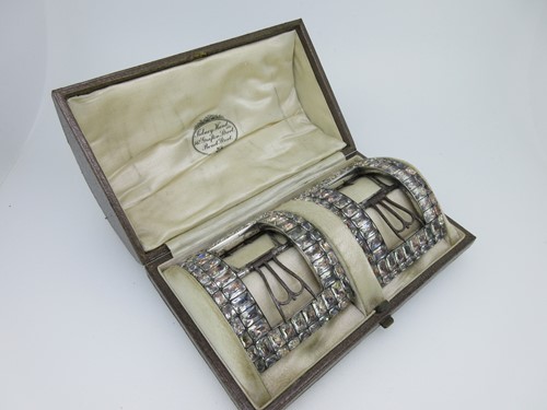 Lot 197 - A pair of Regency steel and paste shoe buckles in a later fitted case