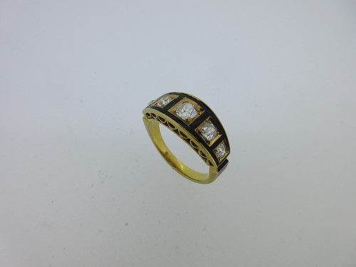 Lot 190 - A diamond and black enamel ring in the neo-classical taste