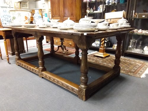 Lot 445 - An Victorian oak refectory table, the canted...