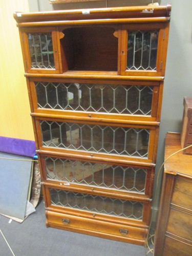 Lot 536 - A globe wernicke walnut bookcase, the 5...
