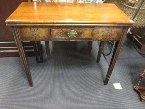Lot 483 - A 19th century mahogany fold over tea table...
