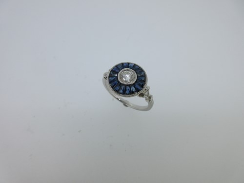 Lot 64 - A sapphire and diamond target ring