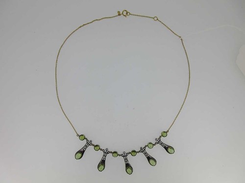 Lot 22 - A peridot and diamond fringe necklace