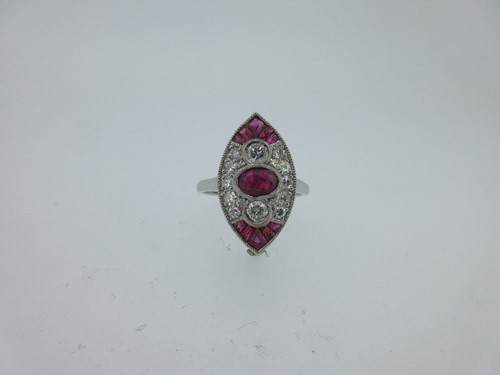 Lot 241 - A ruby and diamond marquise shaped plaque ring