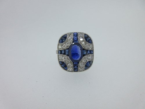 Lot 234 - A sapphire and diamond cushion shaped plaque ring