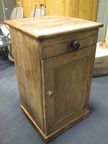 Lot 506 - A pine pot cupboard with a single drawer and...