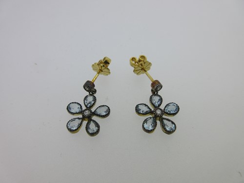 Lot 126 - A pair of blue topaz and diamond daisy ear pendants