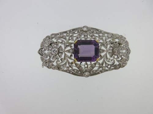 Lot 227 - An Art Deco amethyst and diamond brooch