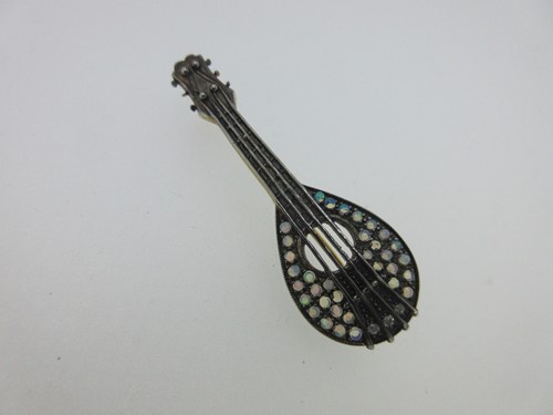 Lot 50 - A mandolin brooch set with opals and diamonds