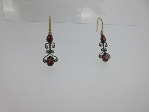 Lot 207 - A pair of garnet and diamond earpendants
