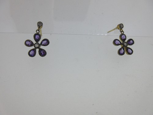 Lot 225 - A pair of amethyst and diamond daisy earstuds