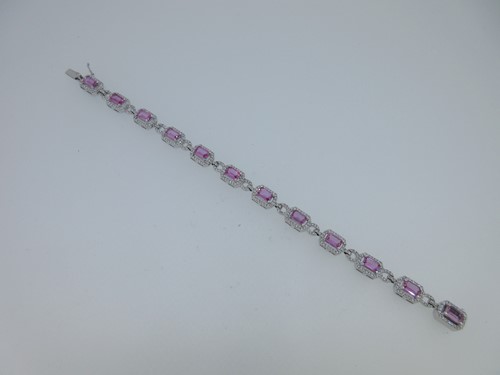 Lot 186 - A pink sapphire and diamond bracelet set in 18ct white gold