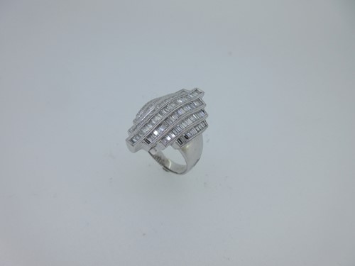 Lot 159 - A modern baguette cut diamond dress ring set in 18ct white gold
