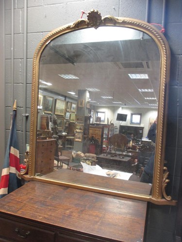Lot 439 - A Victorian gilt framed overmantle mirror, of...