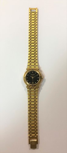 Lot 306 - Gucci - A lady's gold plated and diamond set wristwatch