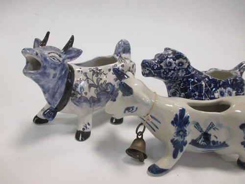 Lot 5 - A collection of 20th century cow creamers, a...