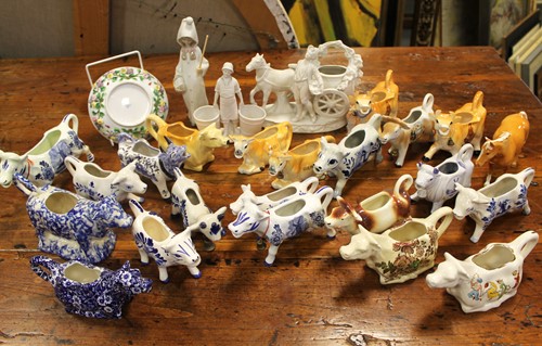 Lot 5 - A collection of 20th century cow creamers, a...