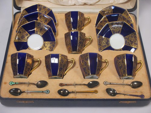 Lot 142 - A Royal Doulton coffee service with enamelled...
