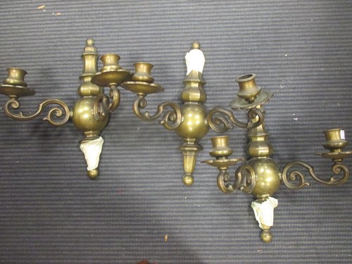 Lot 399 - Three brass two-branch wall lights, in 17th...