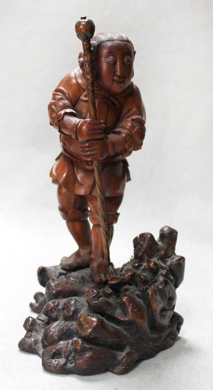 Lot 82 - An Asian carving of a boy, late 19th century