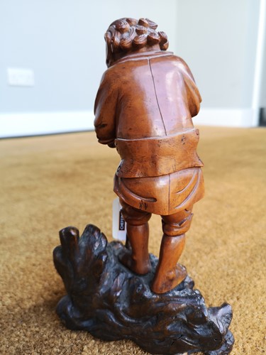 Lot 82 - An Asian carving of a boy, late 19th century