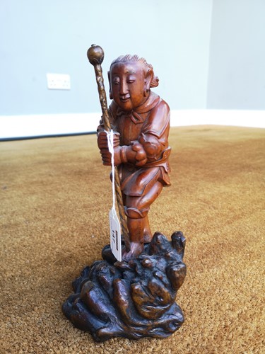 Lot 82 - An Asian carving of a boy, late 19th century