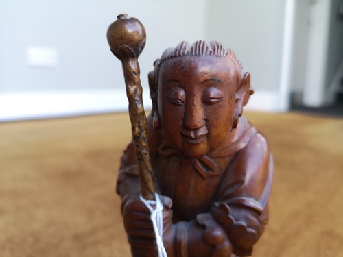 Lot 82 - An Asian carving of a boy, late 19th century