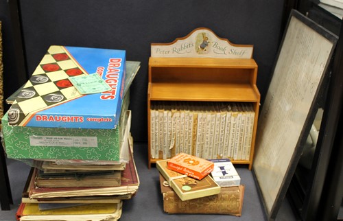 Lot 38 - A Peter Rabbit book shelf complete with books;...