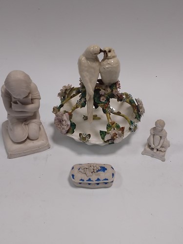 Lot 36 - A parian porcelain figure of a kneeling child...