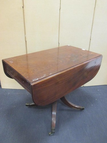 Lot 326 - A late Regency mahogany drop flap supper table,...