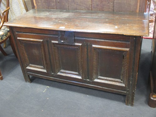 Lot 356 - An early 18th century oak coffer, the three...