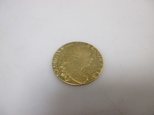 Lot 133 - 1777 gold guinea, good F, 8 grams