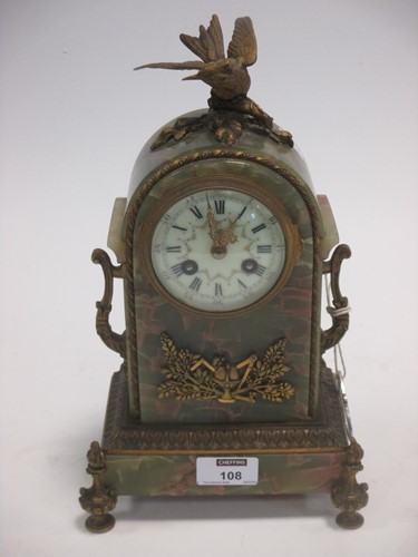 Lot 108 - An early 20th century French onyx mantle clock...