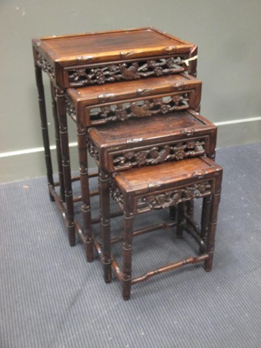 Lot 343 - A nest of four Chinese hardwood occasional...