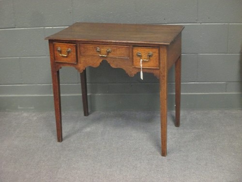 Lot 504 - An antique oak kneehole side table, 71 x 78 x...
