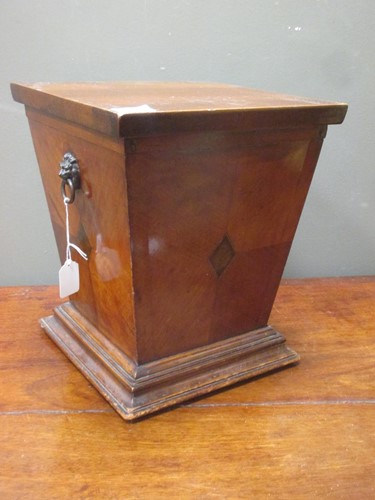 Lot 455 - A Regency mahogany wine cooler on a stepped...