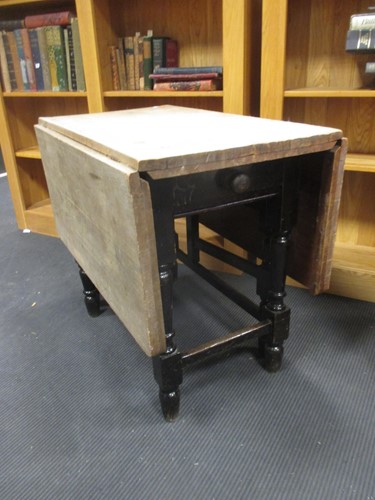 Lot 366 - A pine and black painted gate leg table, 72 x...