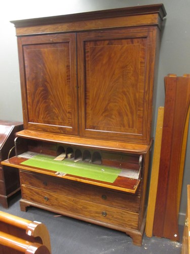 Lot 383 - An early 19th century mahogany secretaire...