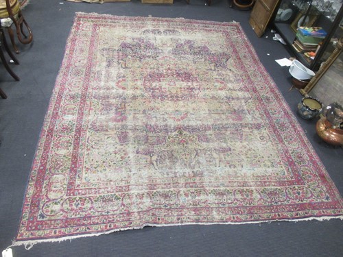 Lot 401 - A worn pink ground Persian carpet 374 x 276cm