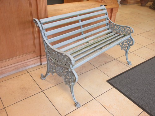 Lot 402 - A grey painted cast iron and wooden garden...