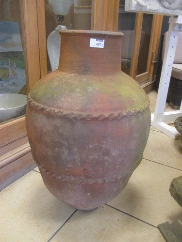 Lot 407 - A 20th century terracotta urn 69cm high...