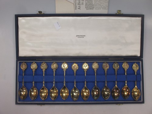 Lot 179 - A cased set of 12 Roman head silver gilt...
